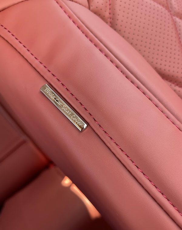 Bhola Car Seat Cover badge stitched into red perforated leather