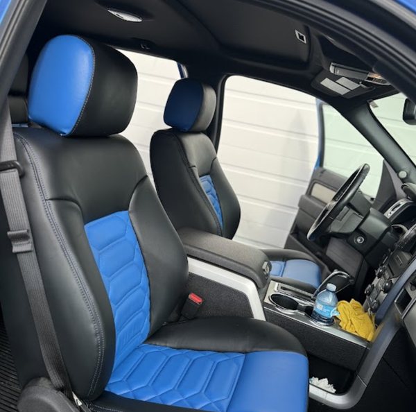 Blue and black two-tone seat covers with hex-quilted inserts fitted in a Ford F-150