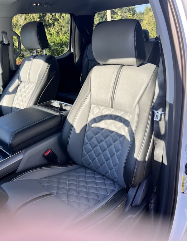 Grey diamond-quilted seat covers with black bolsters in a crew cab