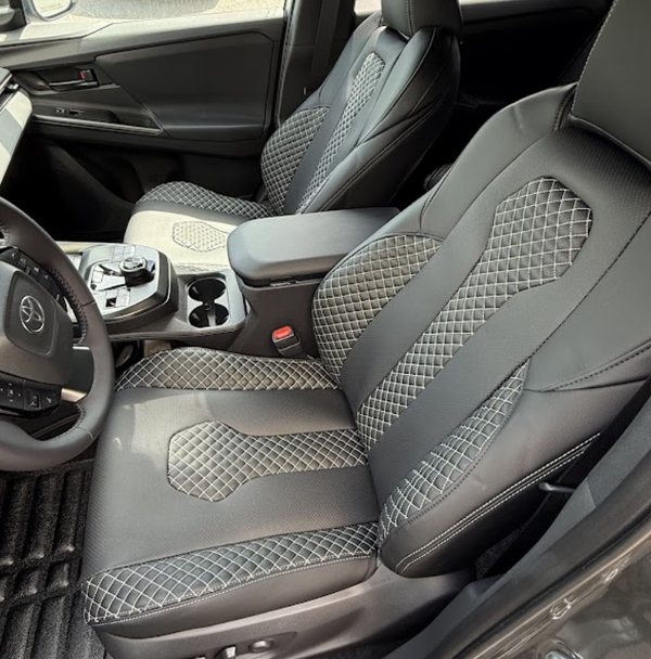 Black leatherette seat covers with grey diamond quilting and contrast stitching fitted in a Toyota RAV4