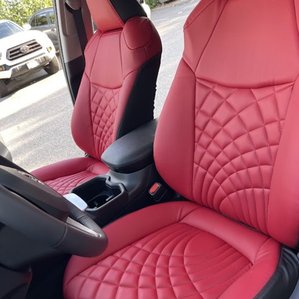 Red leather seat covers with fan-pattern quilting fitted in a Toyota SUV